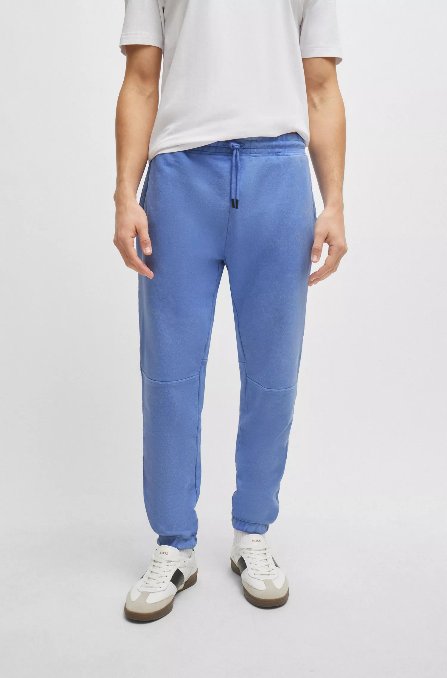 Calça de fato de treino BOSS em tecido atoalhado de algodão laranja com detalhe do logótipo