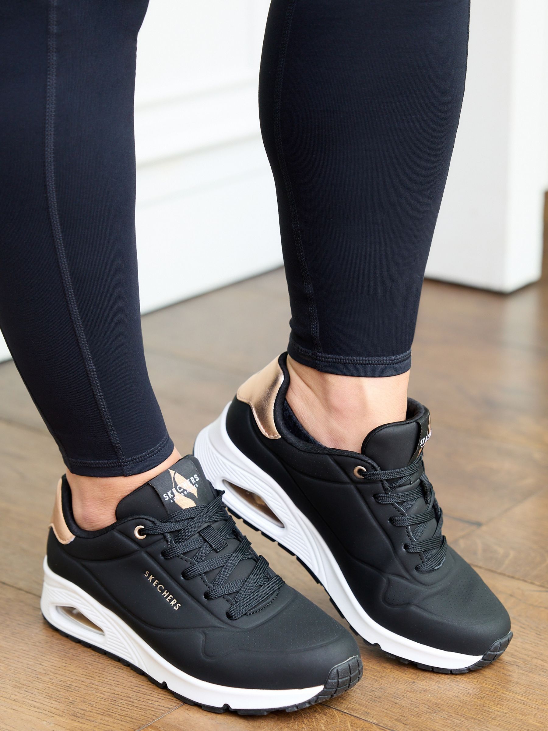 Donkerzwart - Skechers goudkleurige damessneakers met standaard pasvorm Uno