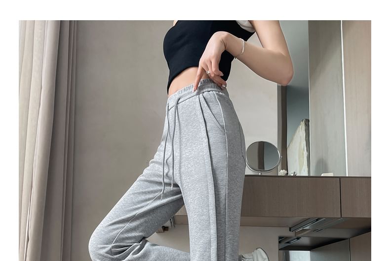 Tel tot 10 - Effen wijd uitlopende broek met trekkoord in de taille (verschillende ontwerpen)