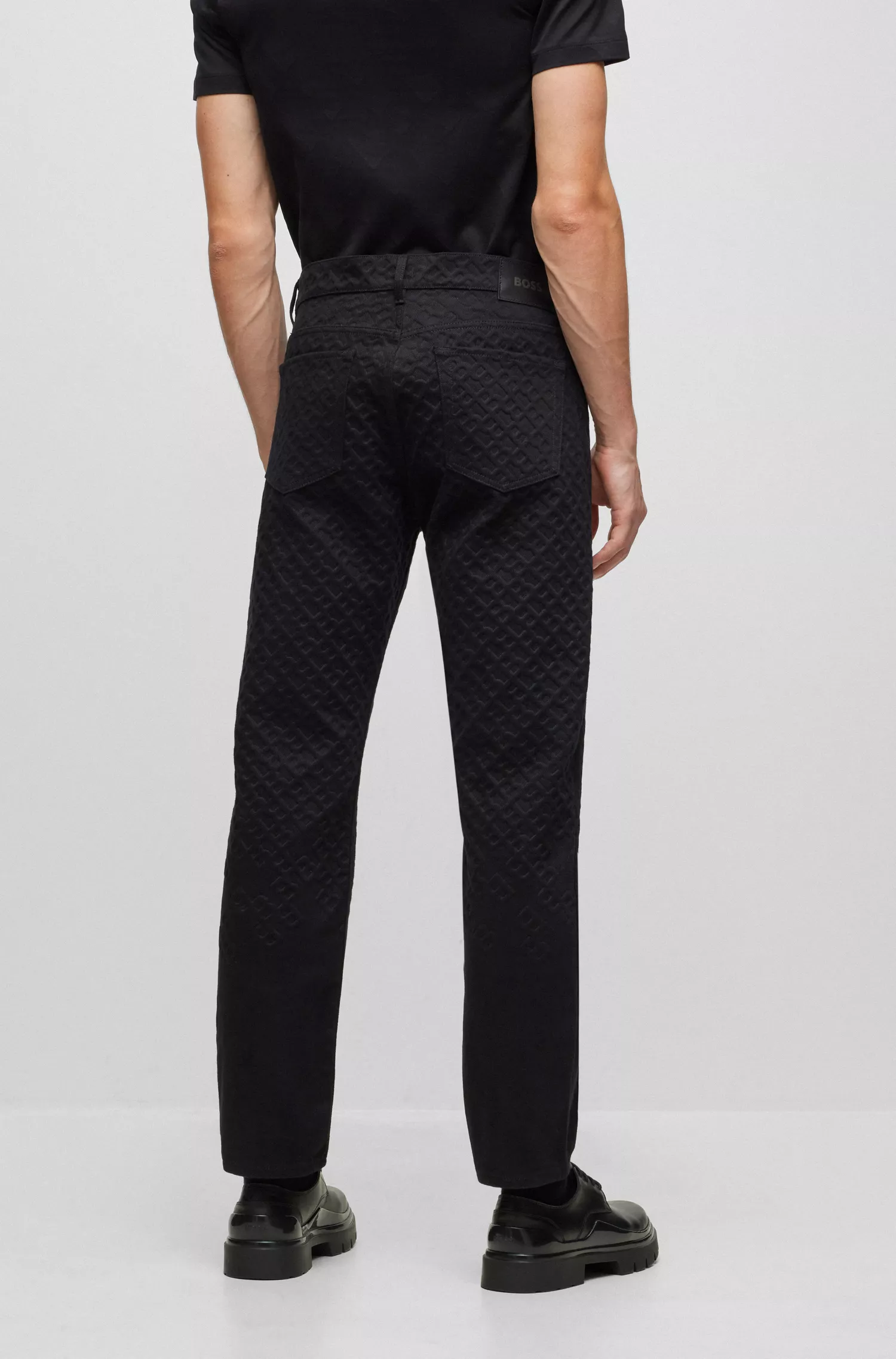 Calça jeans BOSS preta, modelagem relaxada, em denim 100% algodão.