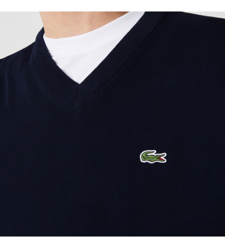 Suéter Lacoste de algodão orgânico com decote em V na cor azul marinho.
