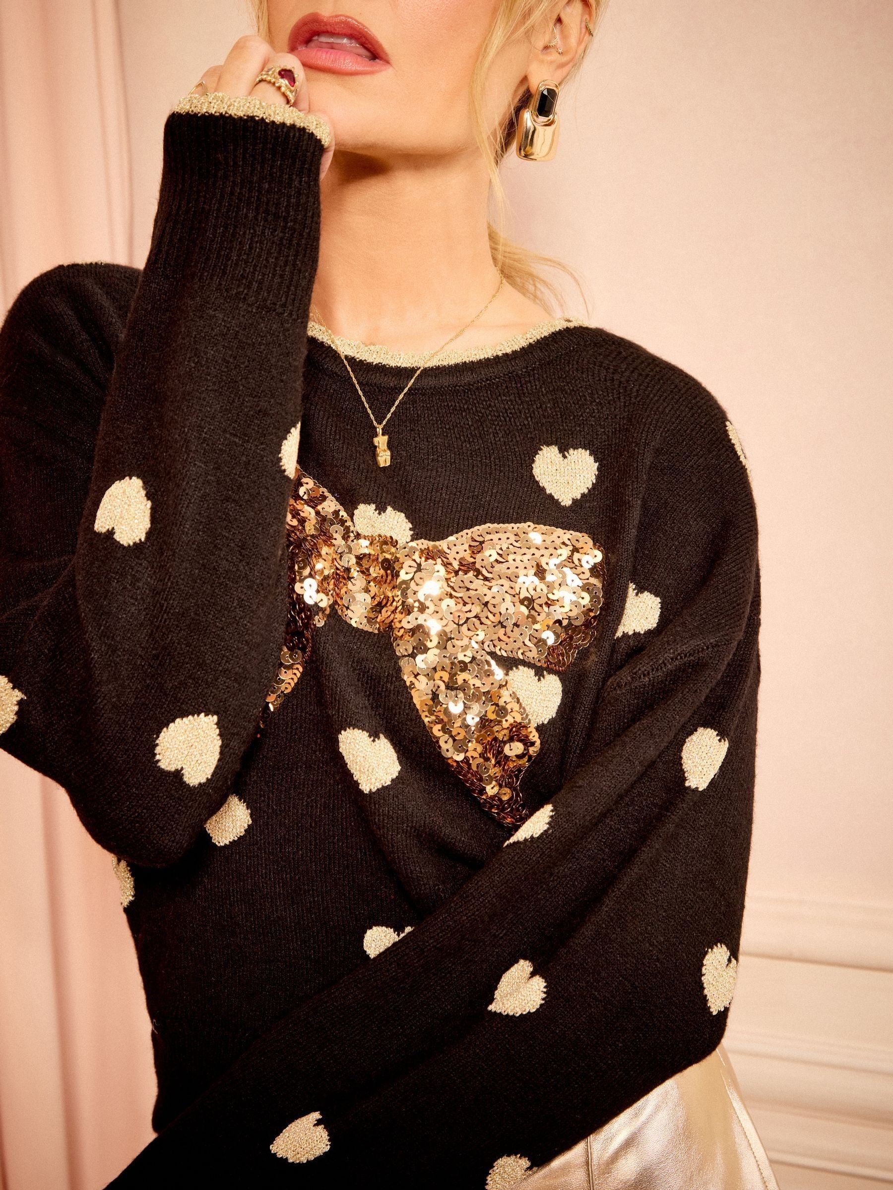 Zwart met goud - Love & Roses - Gebreide kersttrui met lovertjesstrik