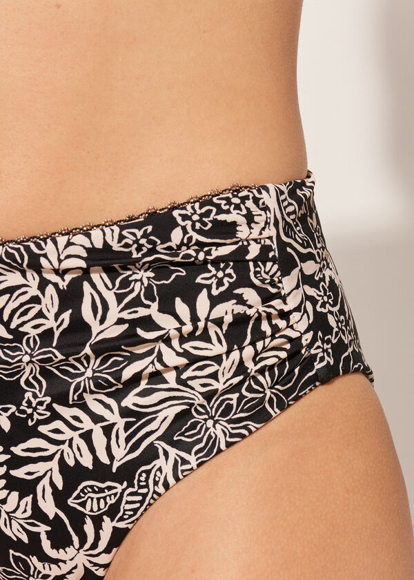 Calcinha de biquíni de cintura alta modeladora com estampa botânica em preto e branco.