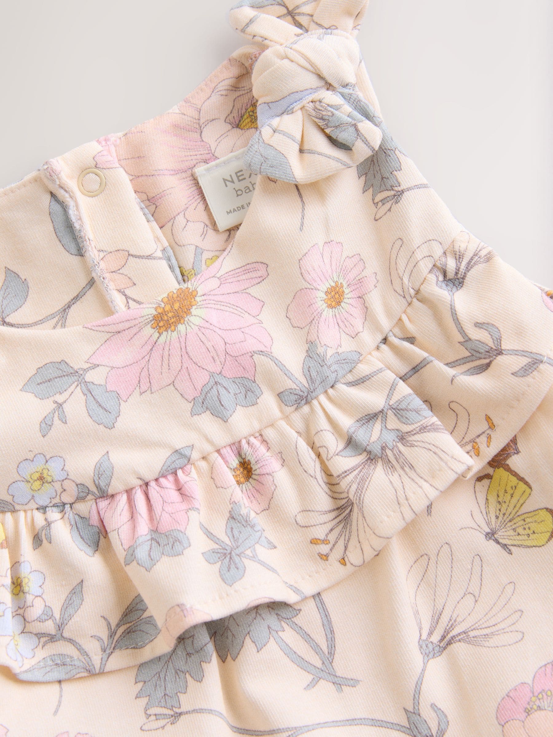 Roze bloemen - Babyromper met lange pijpen (0 mnd - 3 jr)