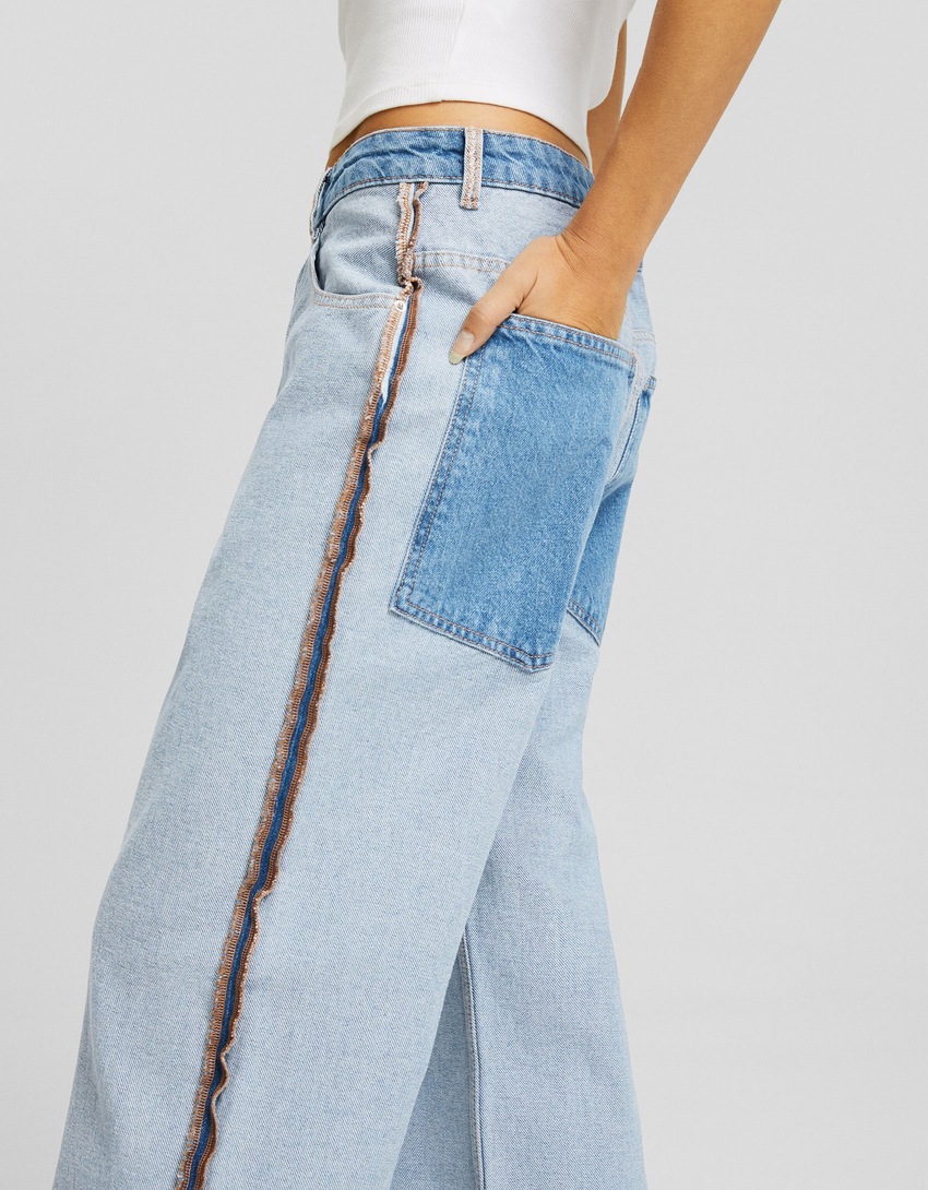 calças jeans largas ao contrário