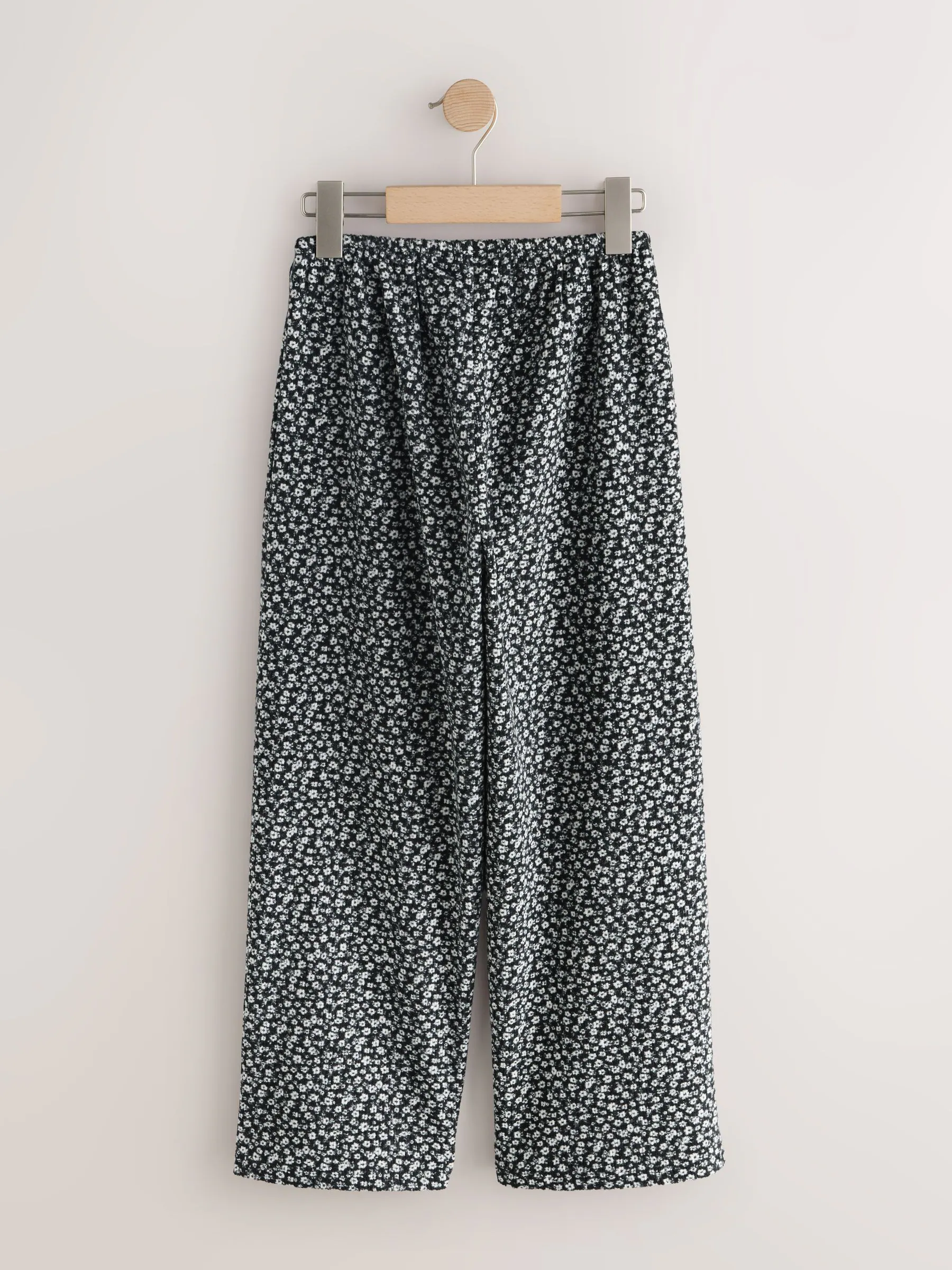 Zwart/wit met bloemenprint - Broek met wijde pijpen (3-16 jr)