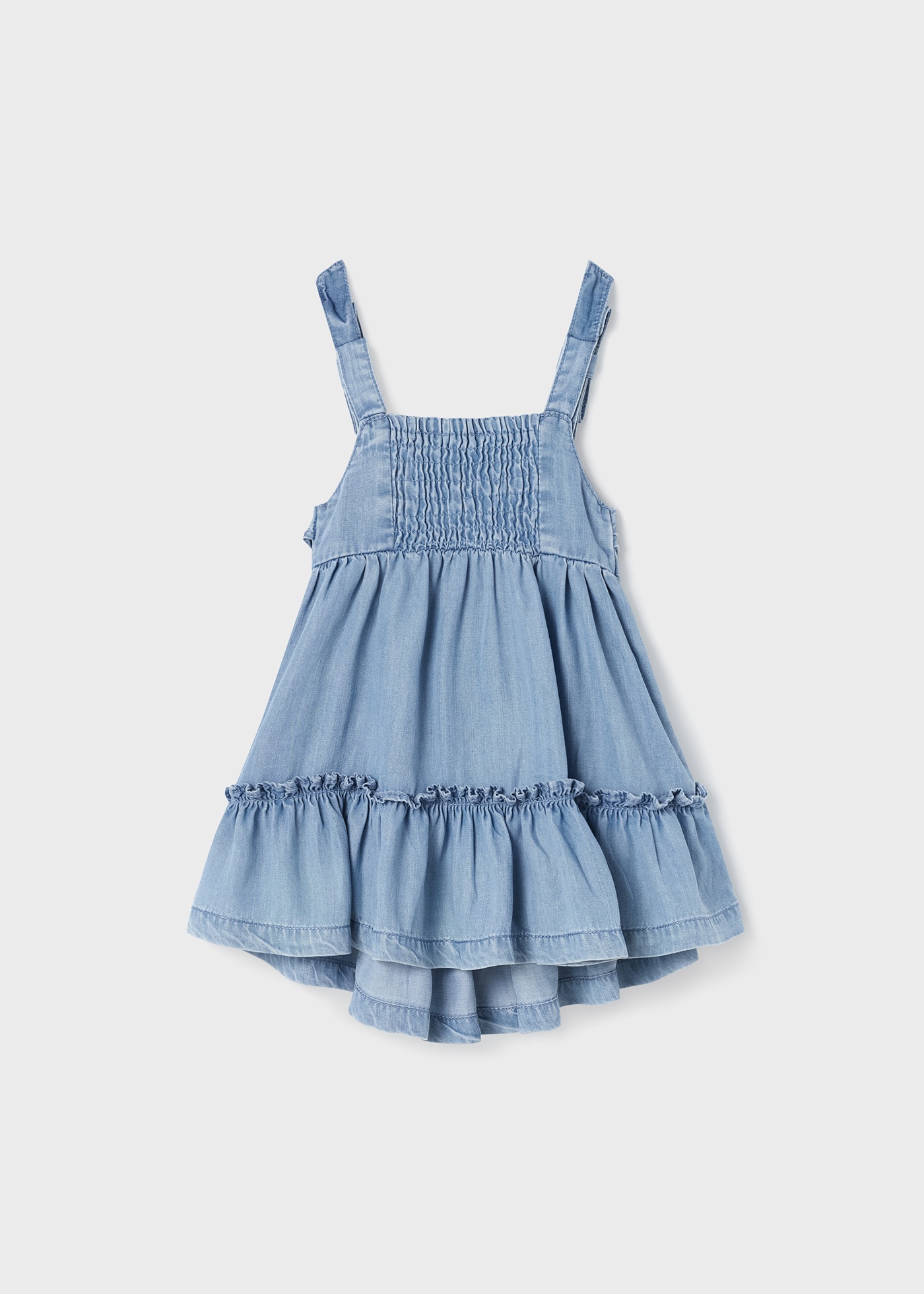 Vestido jeans fluido para bebê, confeccionado em TENCEL™ Lyocell.