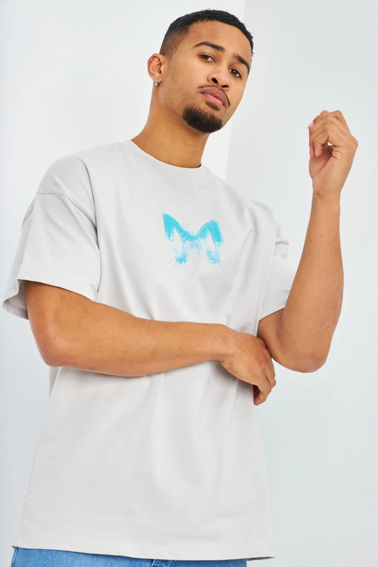 T-shirt gris clair oversize papillons bleus