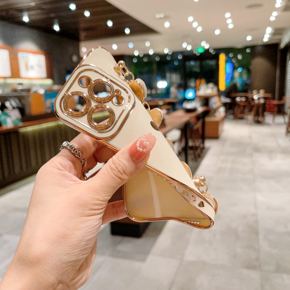 iPhone 14 Pro Gummi Hülle mit Plüsch Herz Kette Handschlaufe   Kameraschutz - Rosa / Gold