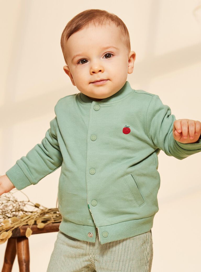Gilet réversible vert et vanille en molleton style varsity