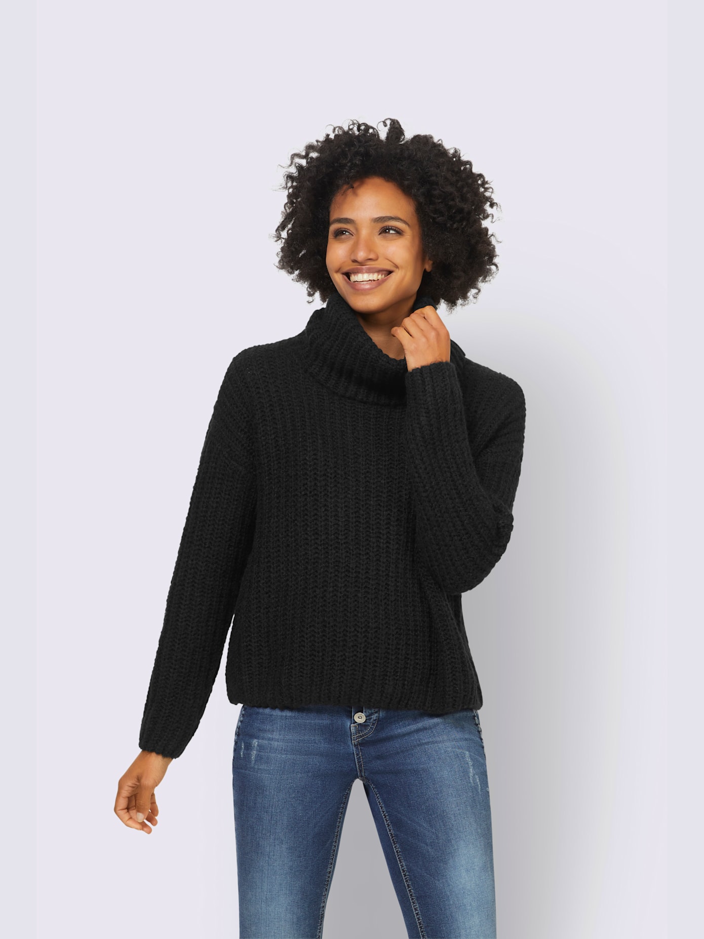 Pull grand col roulé