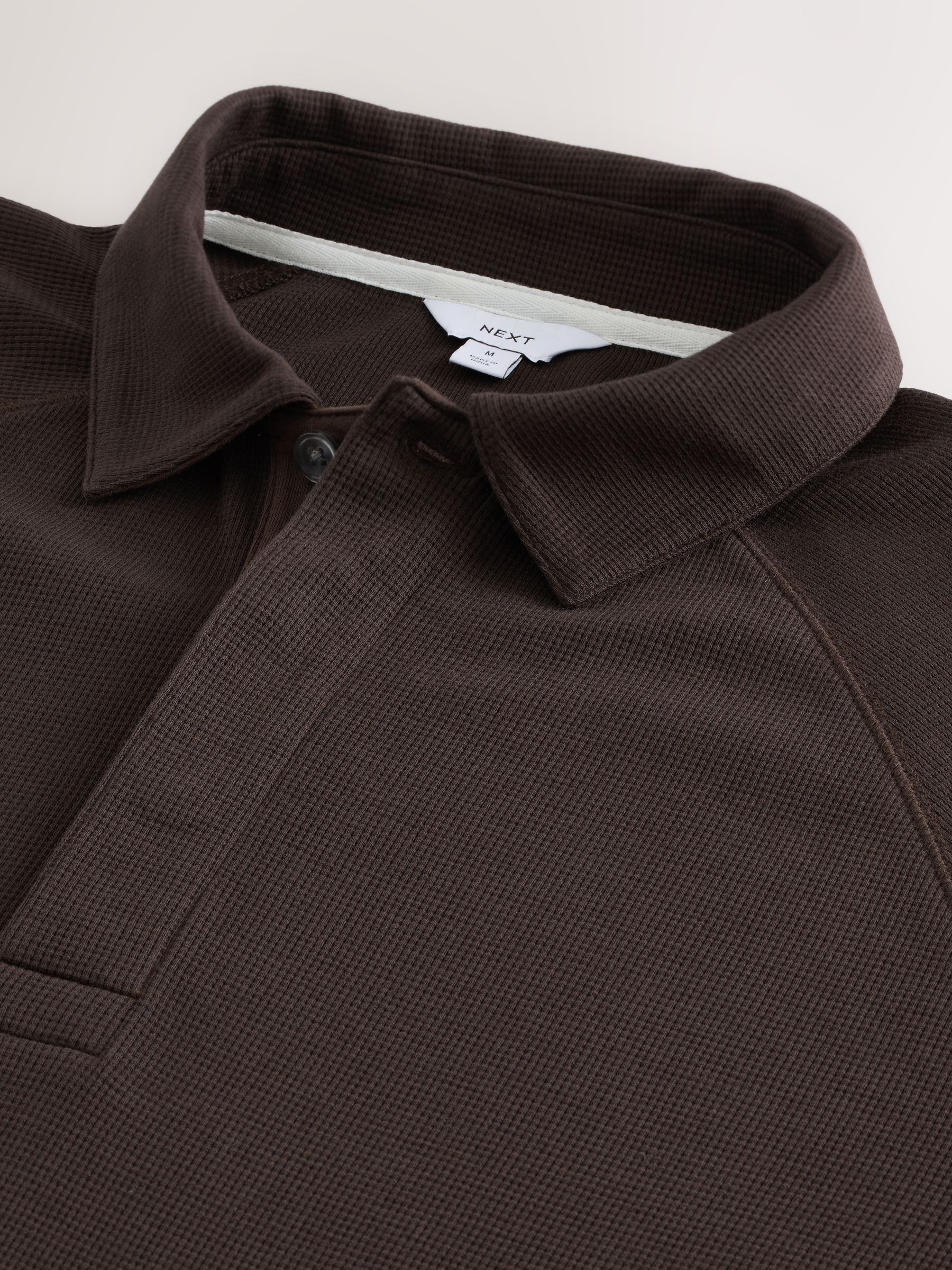 Bruin - Polo met lange mouwen en wafeltextuur