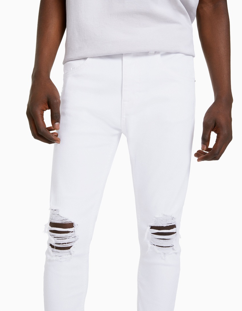 calça jeans super skinny rasgada