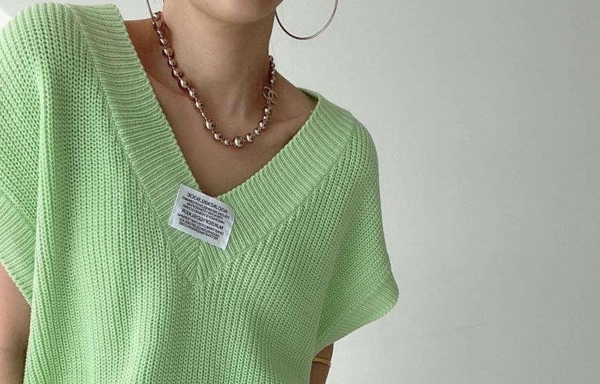 Coris - V-hals effen label applicatie gebreide trui vest