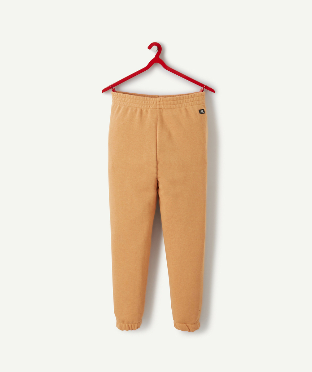 NEW BALANCEJOGGING FILLE ORANGE ESSENTIALS REIMAGINED AVEC LOGO