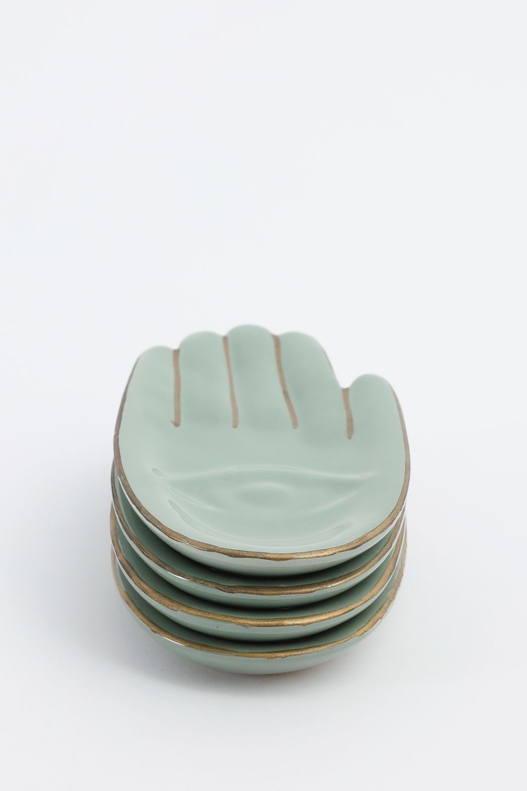 Groene gebaksbordjes hand