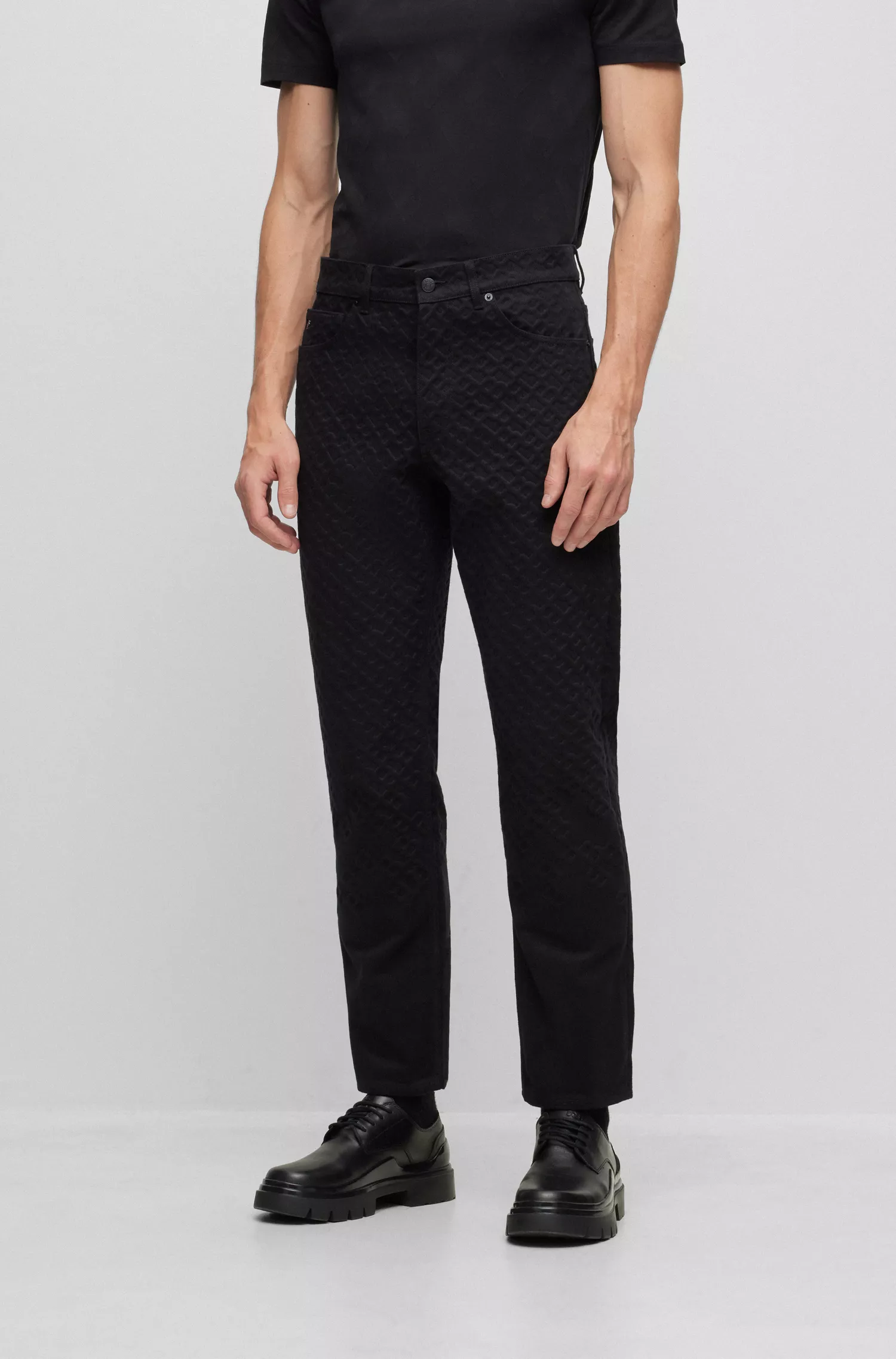 Calça jeans BOSS preta, modelagem relaxada, em denim 100% algodão.