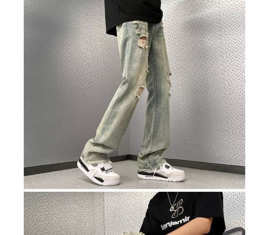 Femilina - High-waist distressed washed jeans met wijde pijpen