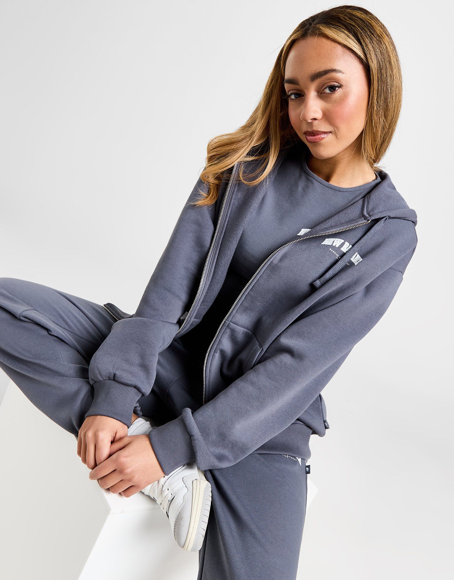 New Balance Sweat à Capuche Zippé Logo Femme