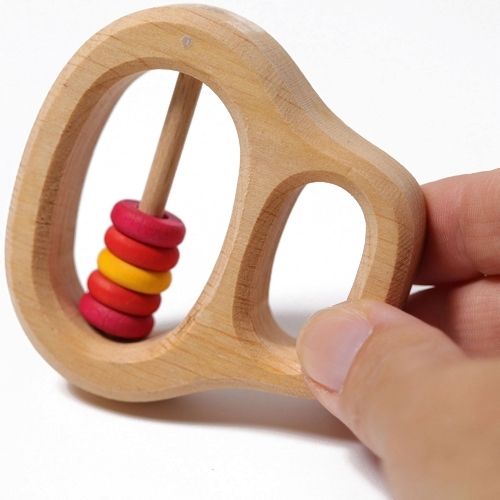Grimm's rammelaar en bijtring met rode ringetjes