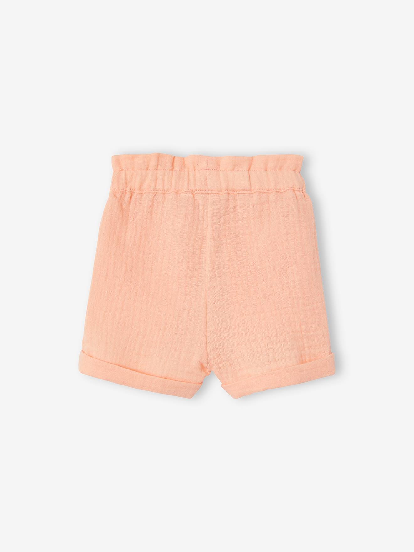 Calções de bebé com cintura elástica em chiffon de algodão liso cor laranja claro.