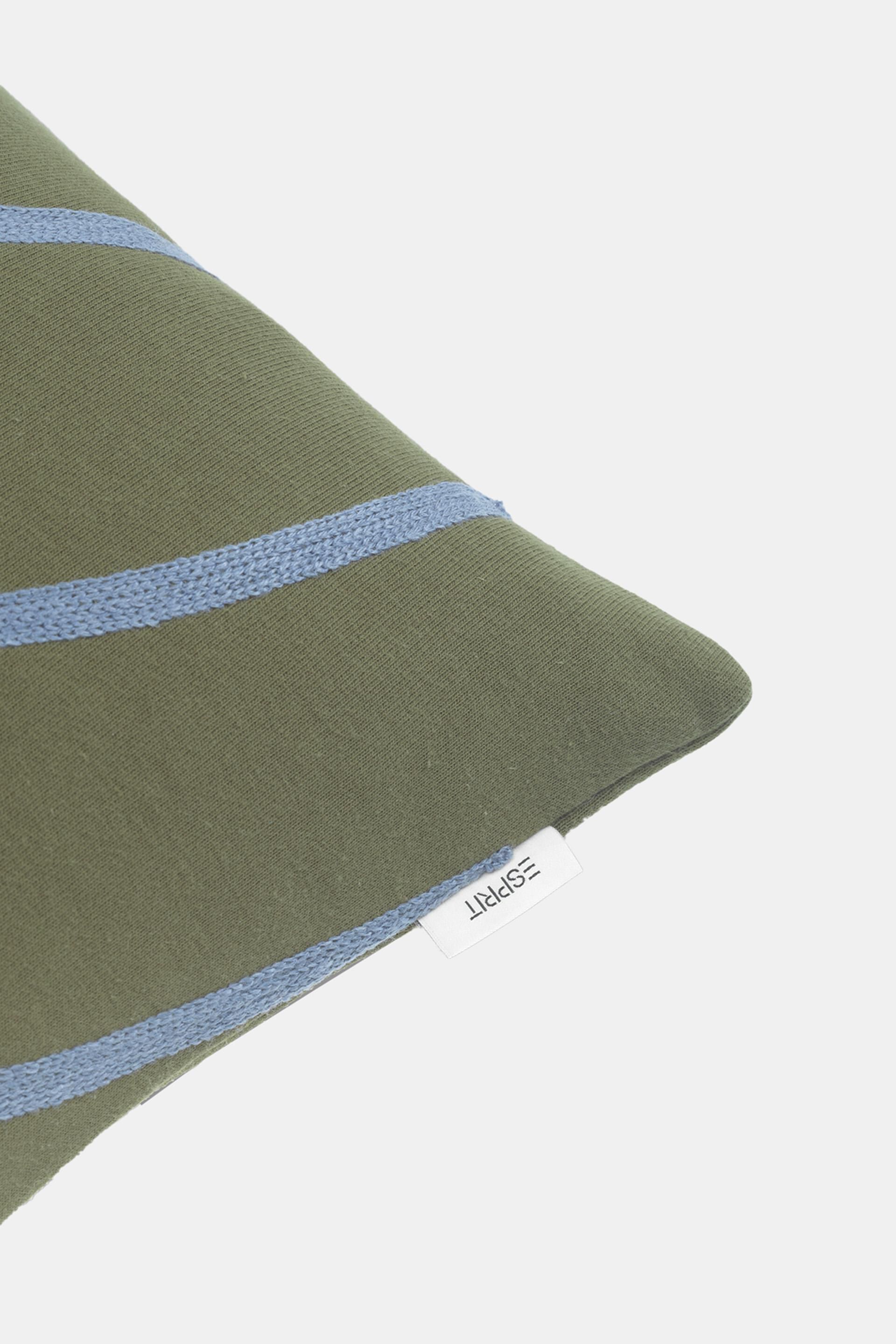 Housse de coussin animée d’un motif de courbes brodé