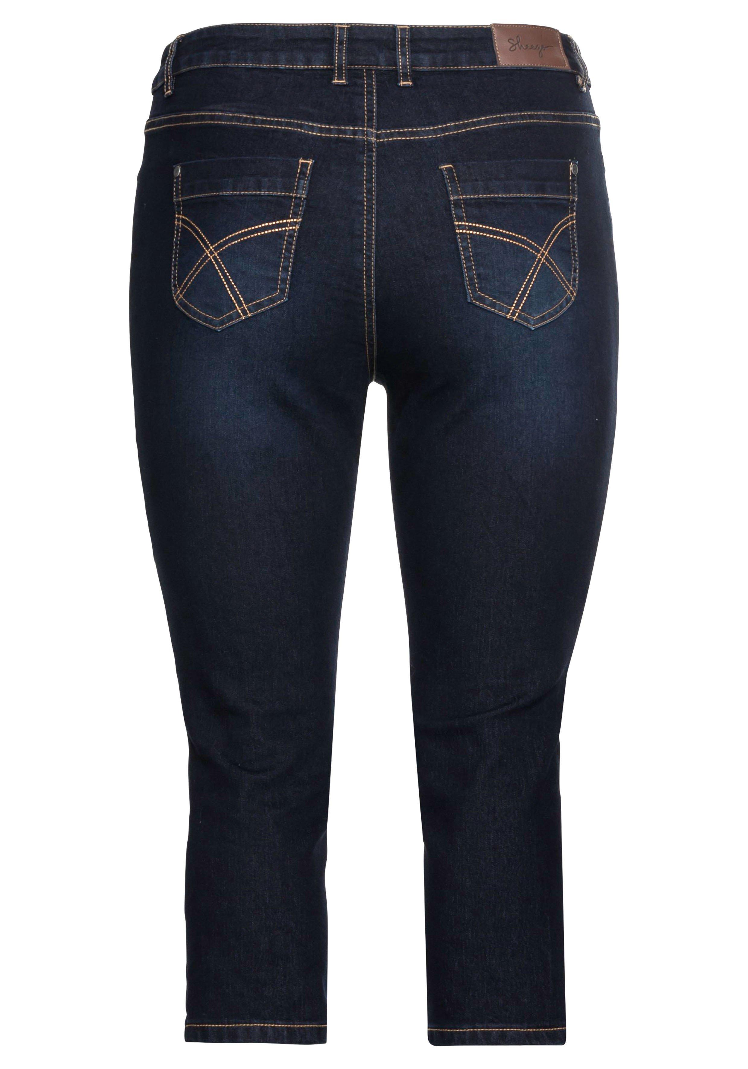 Caprijeans mit Kontrastnähten und Catfaces