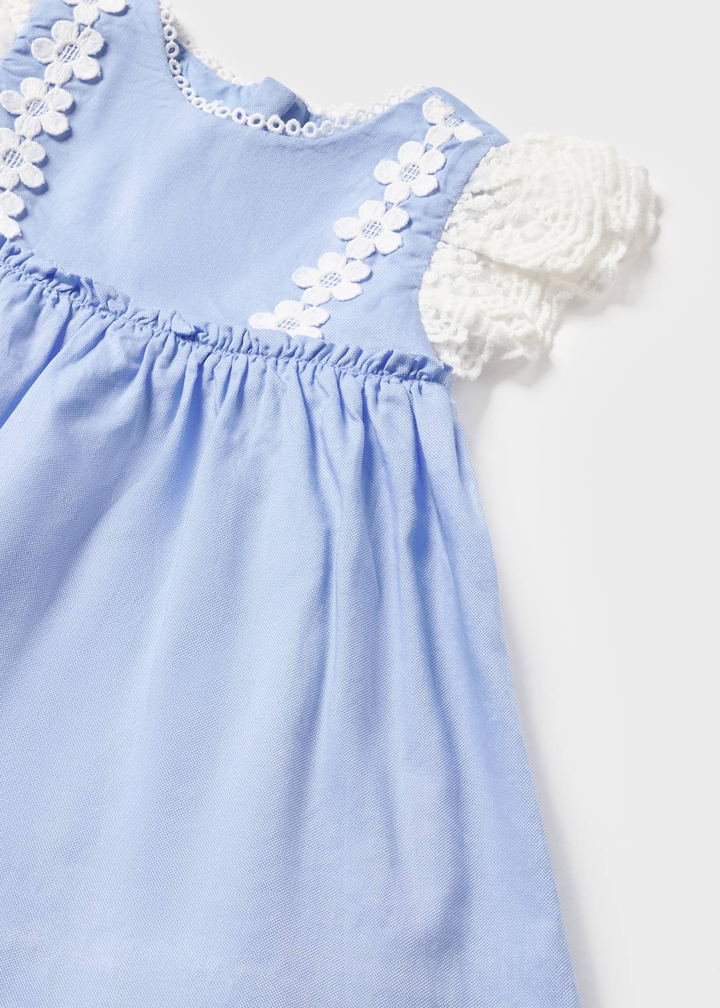 Vestido de bebê com capa de fralda em algodão sustentável