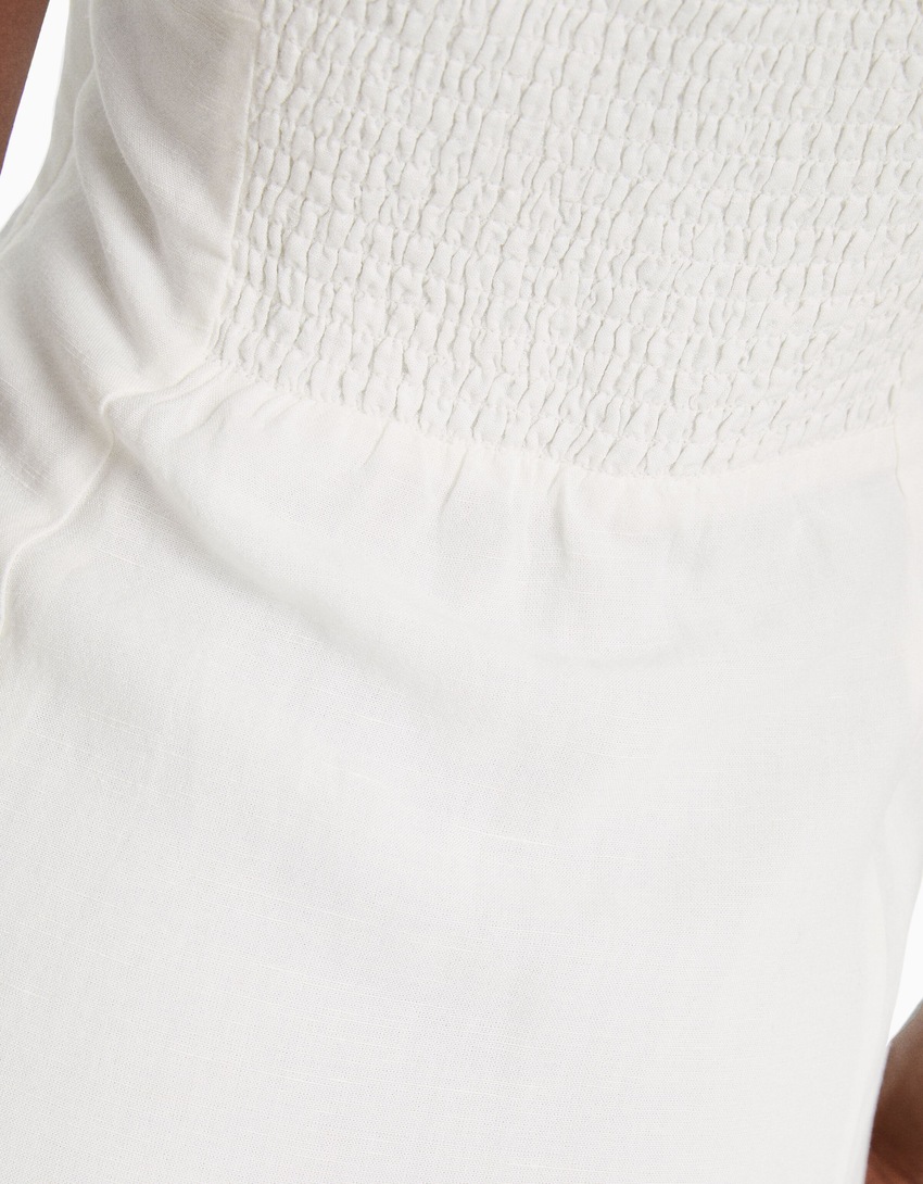 Vestido curto de linho misto com alças finas e detalhe de nó.