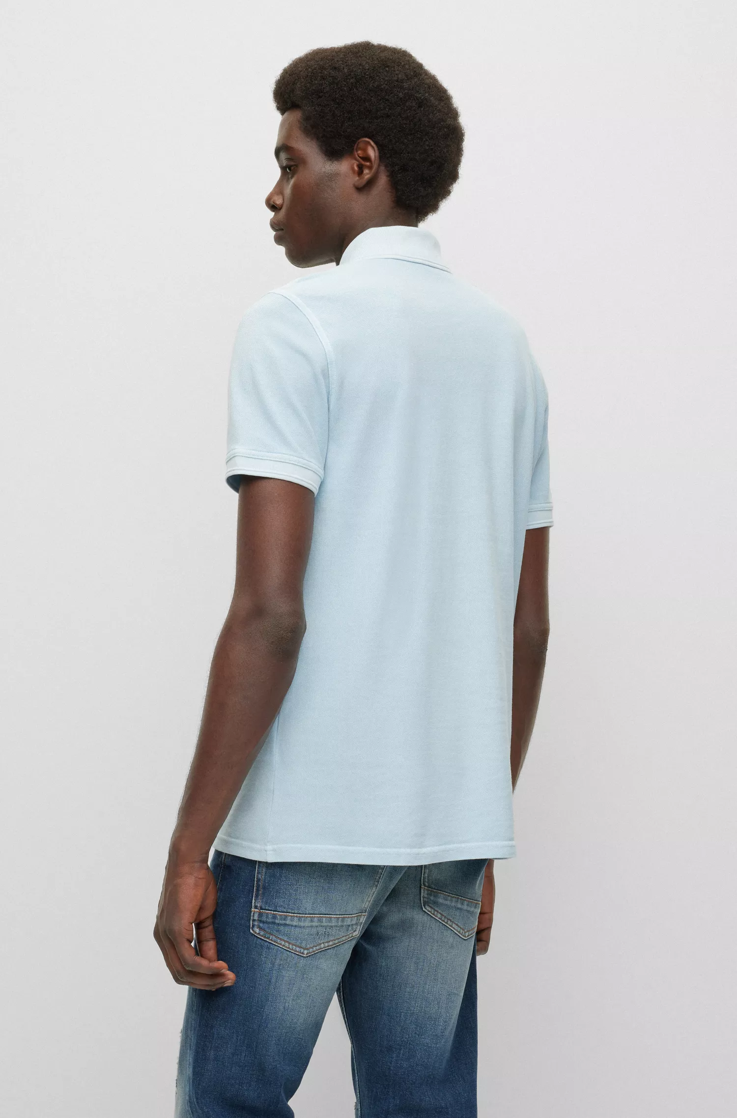 Camisa polo BOSS laranja, corte slim, em piqué de algodão.