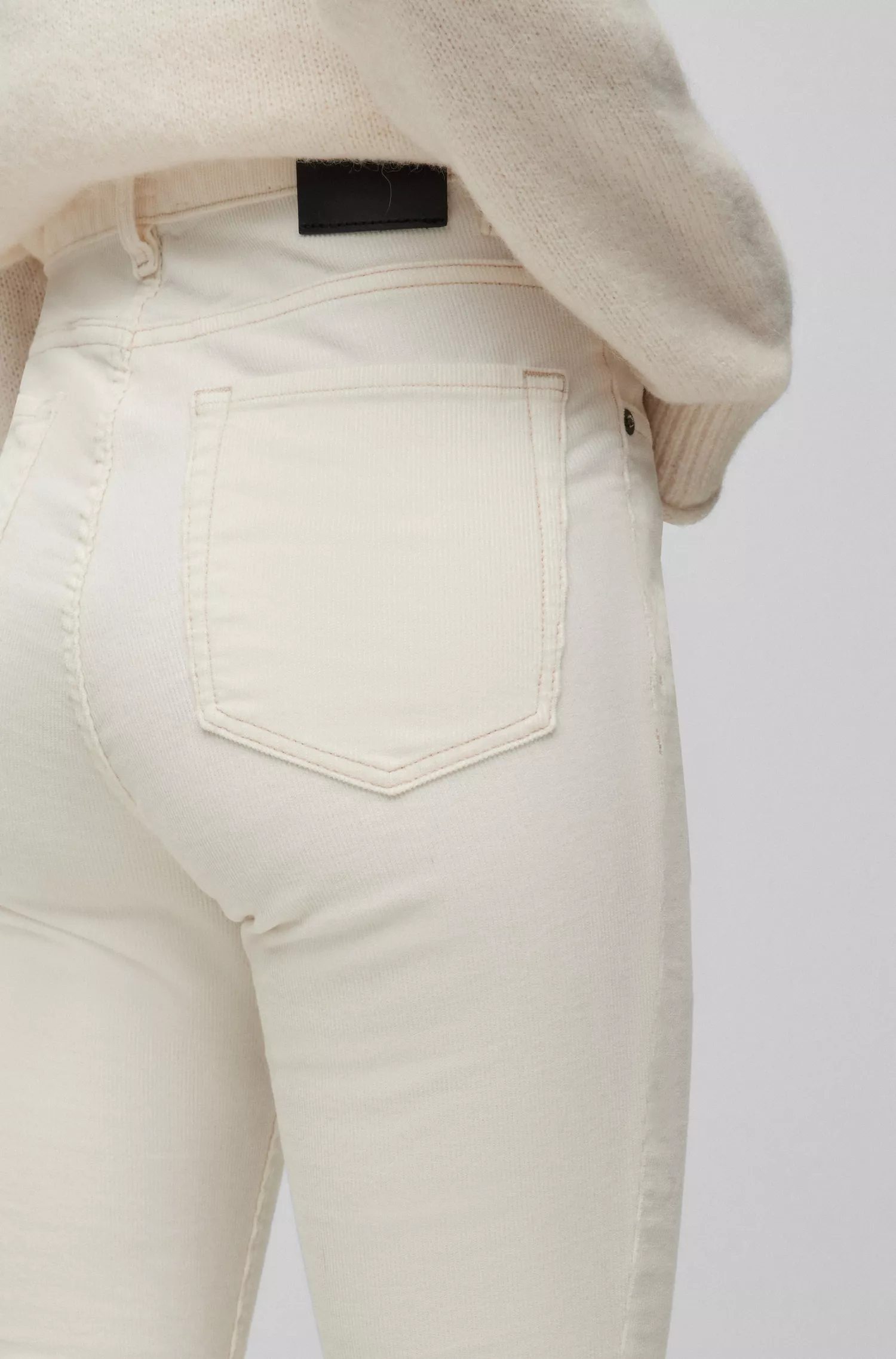 Calça jeans BOSS laranja de cintura alta em veludo cotelê de algodão elástico.