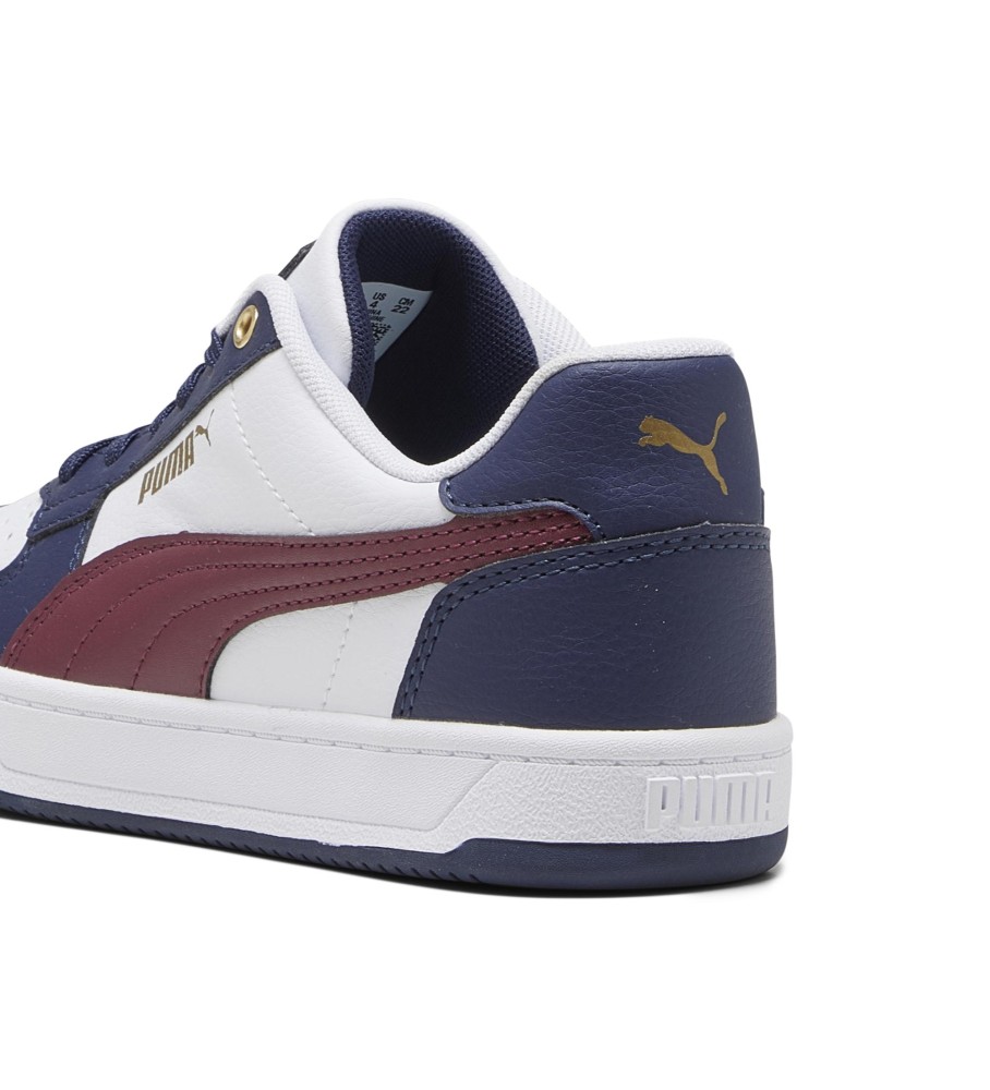 Tênis Puma Caven 2.0, branco e azul marinho.