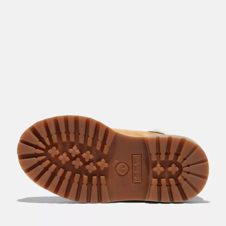 Bota de inverno Timberland Premium de 6 polegadas para crianças pequenas, na cor amarela.