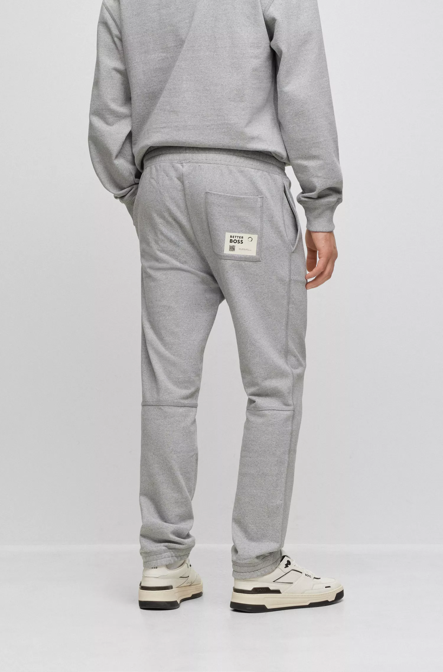 Calça de fato de treino BOSS laranja, corte relaxado, em algodão felpudo francês.