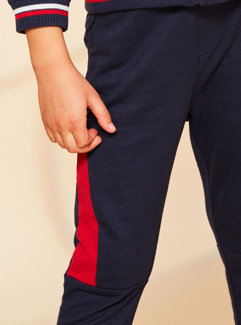 Jogging bleu marine à empiècements rouges