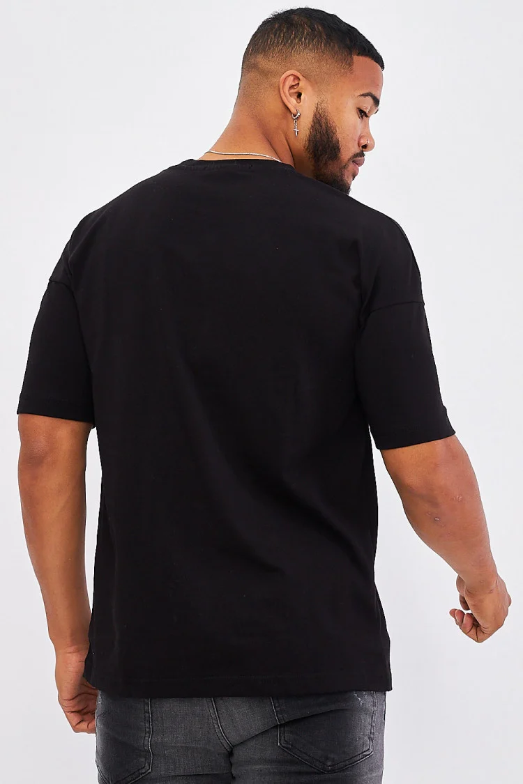 T-shirt noir poche à rabat