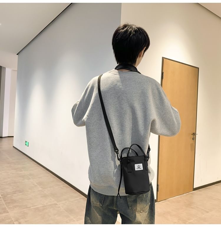 Hikuozy - Crossbodytas met trekkoord en letters