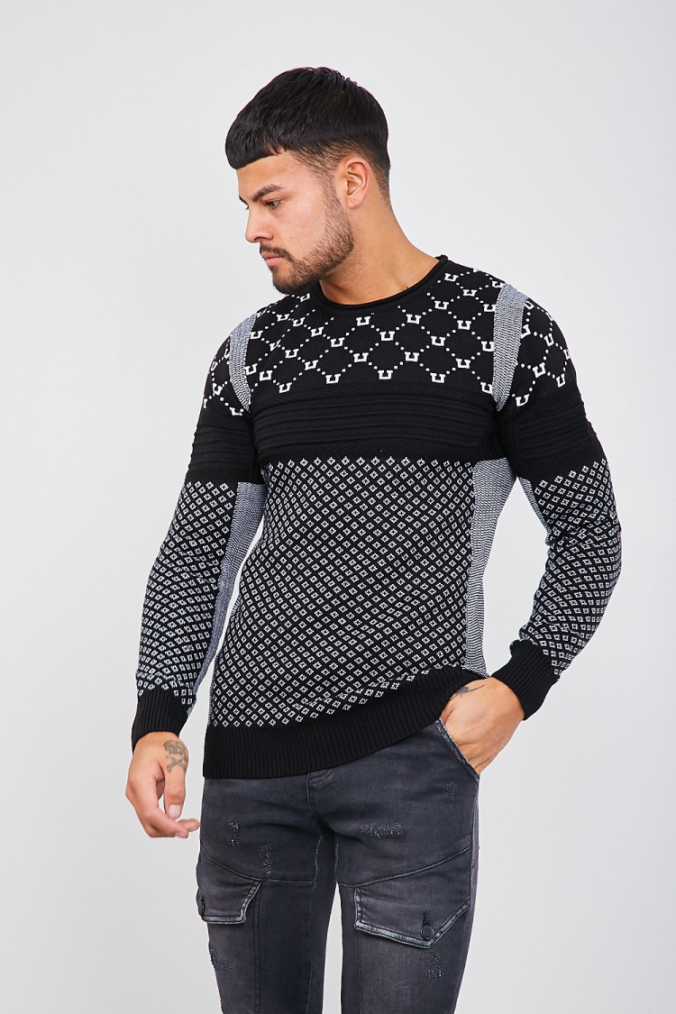 Pull en maille noir à différents motifs blancs