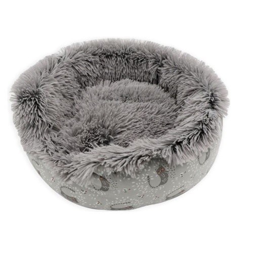 Cama redonda AIME em couro bege para animais de estimação de pequeno porte.