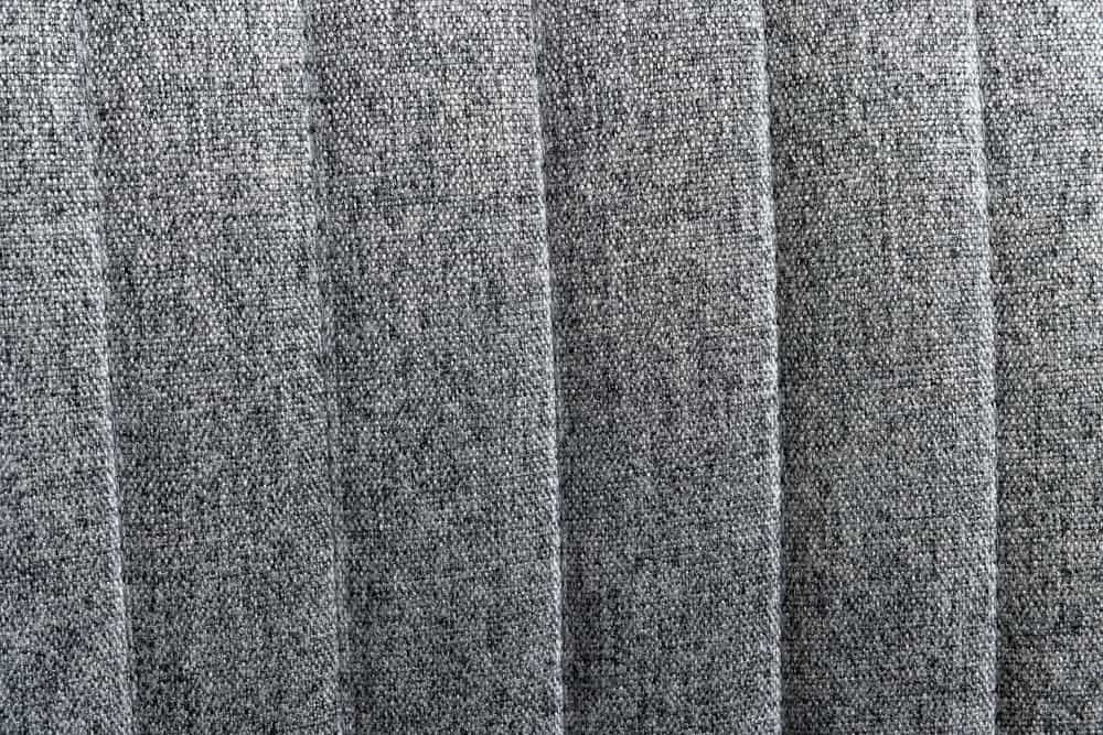 Drehbarer Sessel LOUNGER grau Strukturstoff Metallgestell schwarz