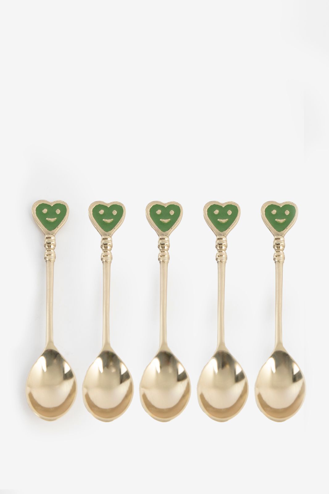 Groene en goudkleurige theelepels met smiley hartjes