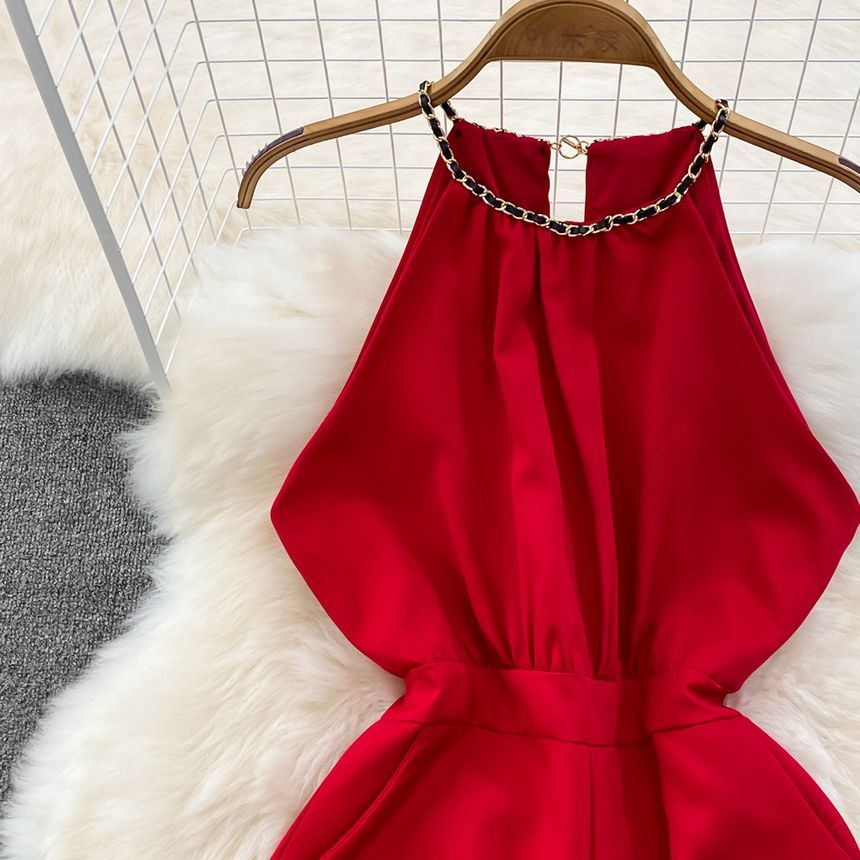 Yearnin - Mouwloze halter romper met wijde pijpen