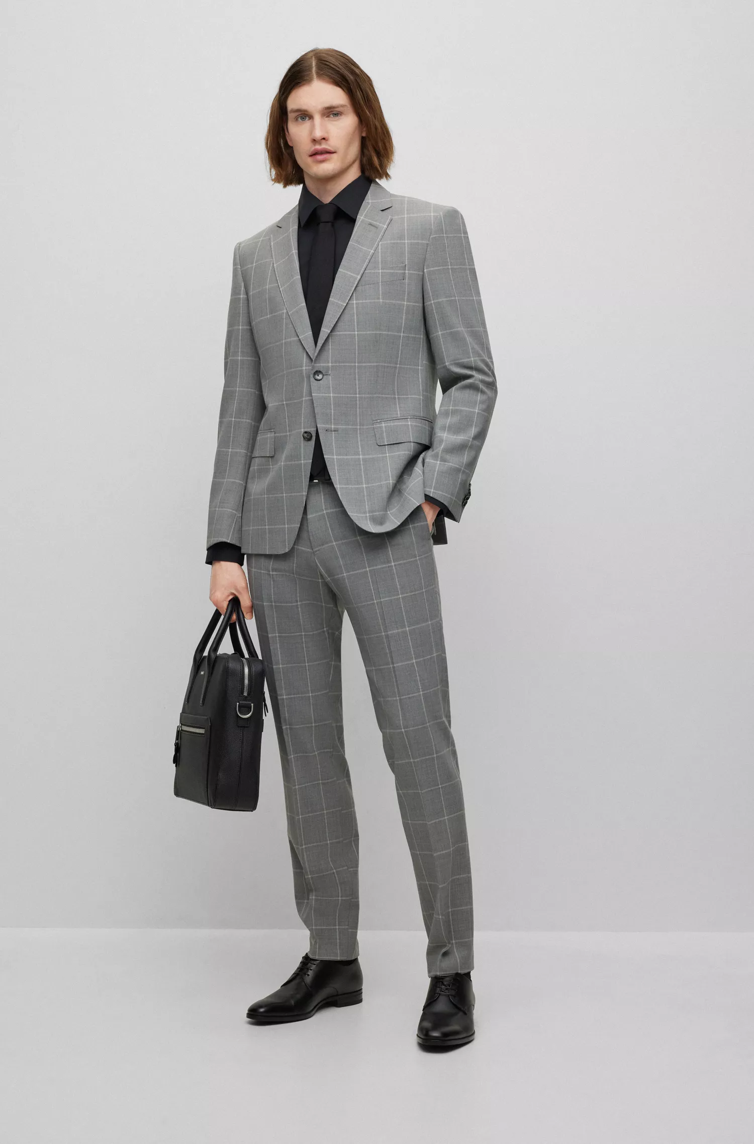 Calça BOSS preta de corte slim em tecido elástico xadrez.