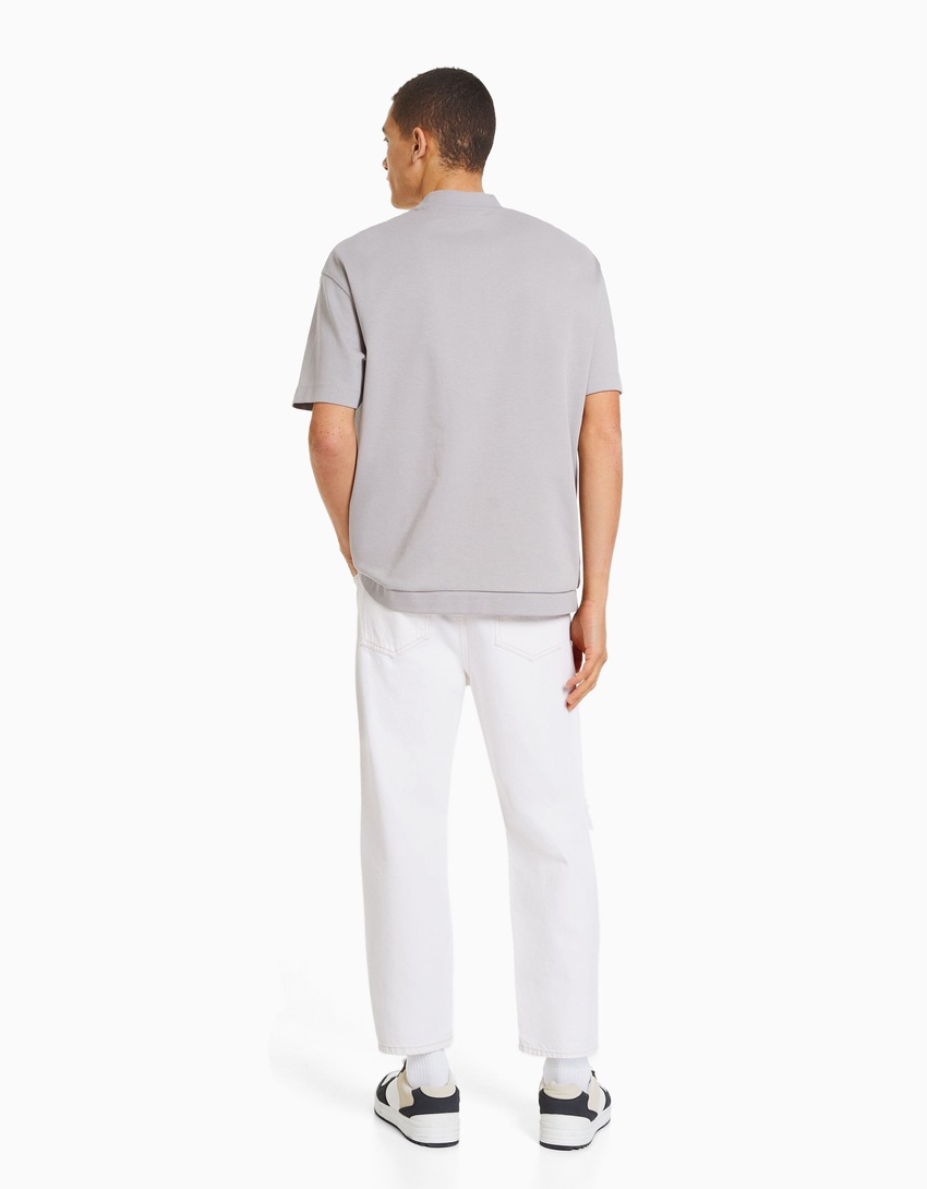 Calça jeans folgada com rasgos