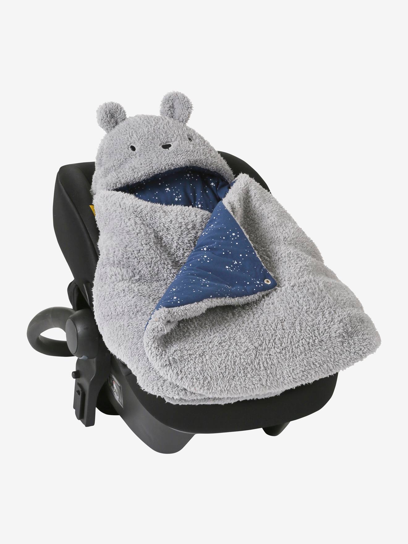 Saco transformável em brinquedo de pelúcia. Urso de pelúcia liso bege claro com estampas.