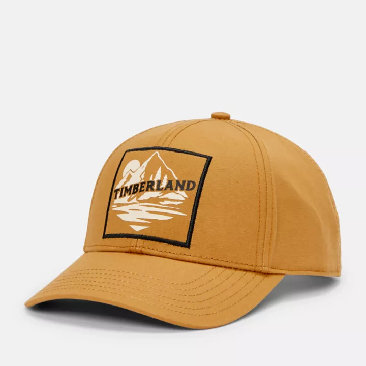 Boné de beisebol unissex com patch de montanha na cor amarela.