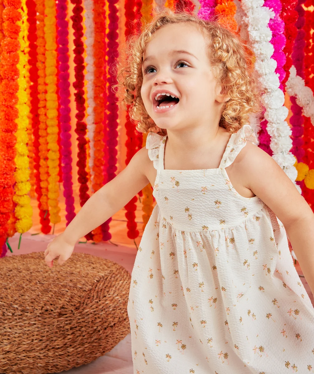 ROBE BÉBÉ FILLE EN COTON GAUFRÉ ÉCRU IMPRIMÉ PALMIERS