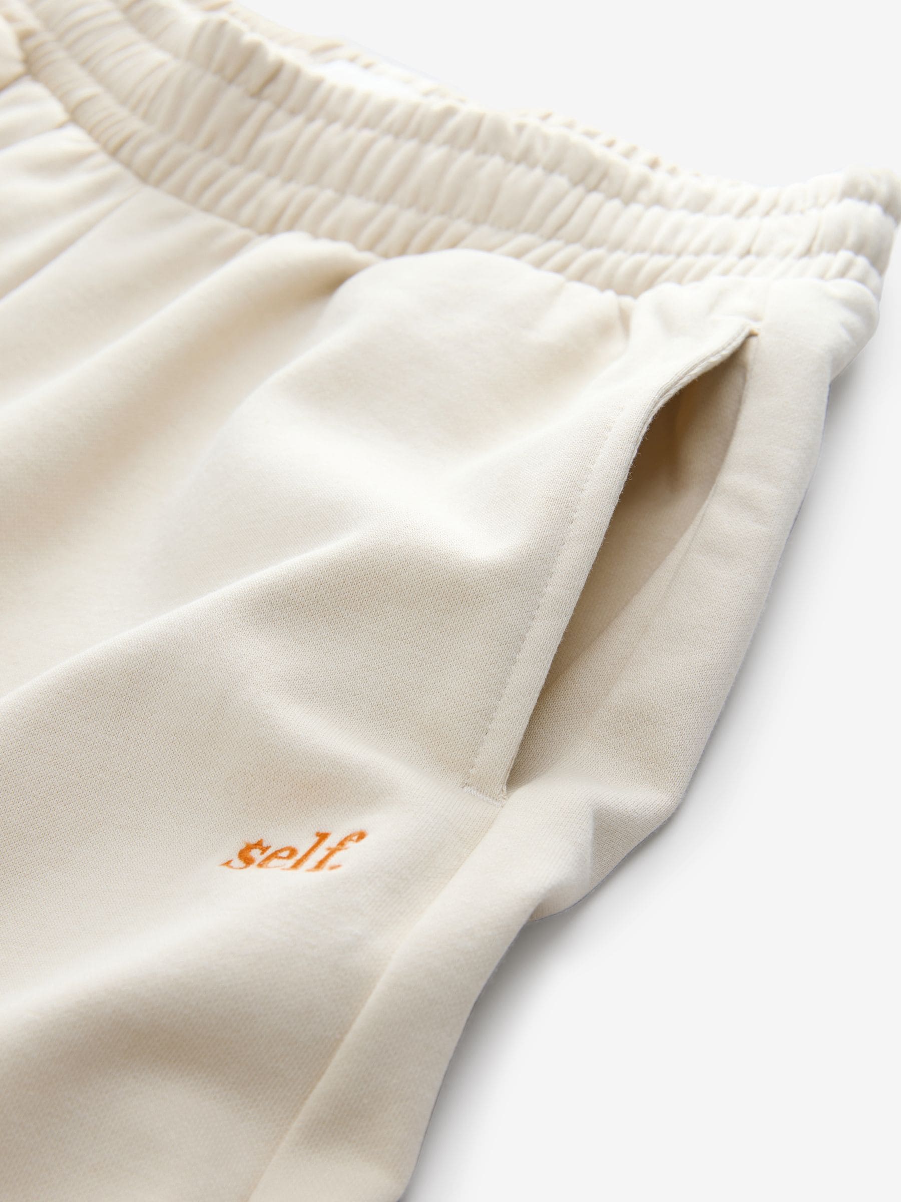 Pastelgeel - self. joggingbroek met wijde pijpen