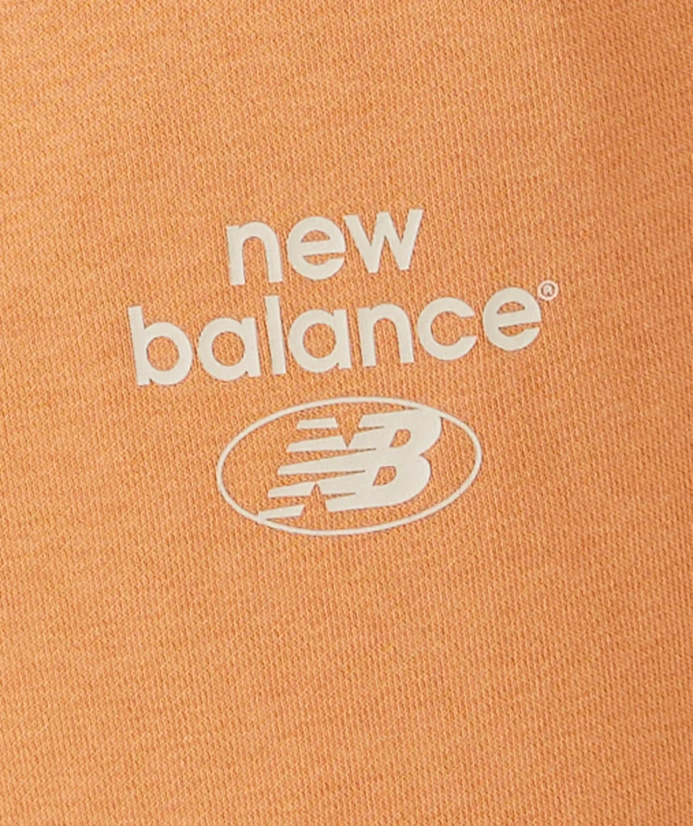 NEW BALANCEJOGGING FILLE ORANGE ESSENTIALS REIMAGINED AVEC LOGO