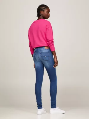 Calça jeans Nora de cintura média, skinny e desbotada.
